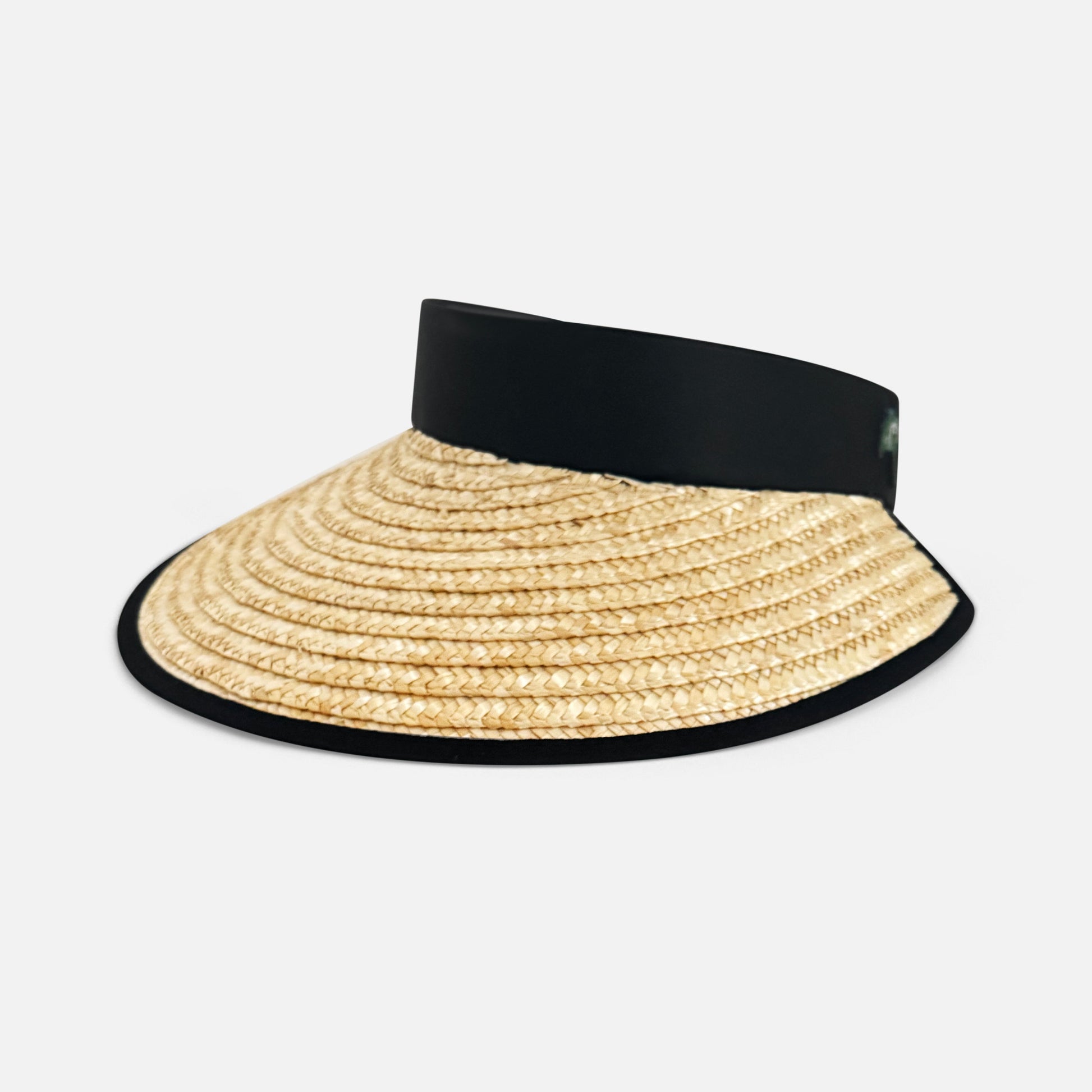 Straw visor hat with black band on a white background