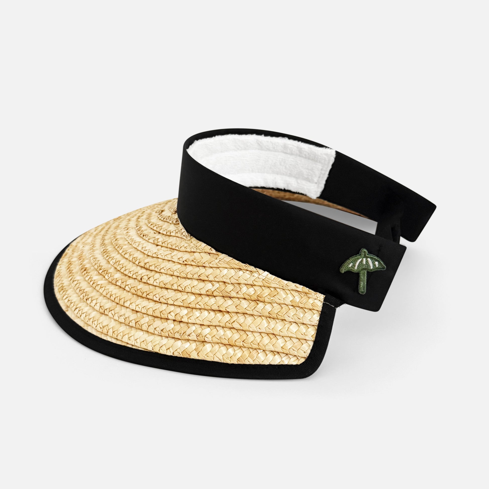 Straw visor with black band and green logo on a white background