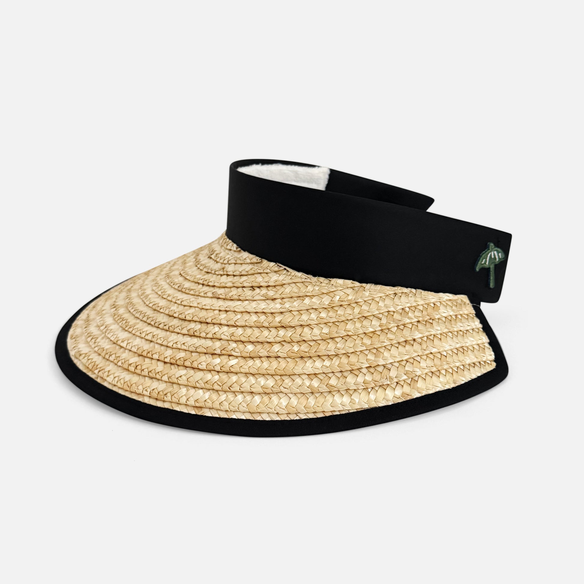 Beige straw visor with black band on a white background